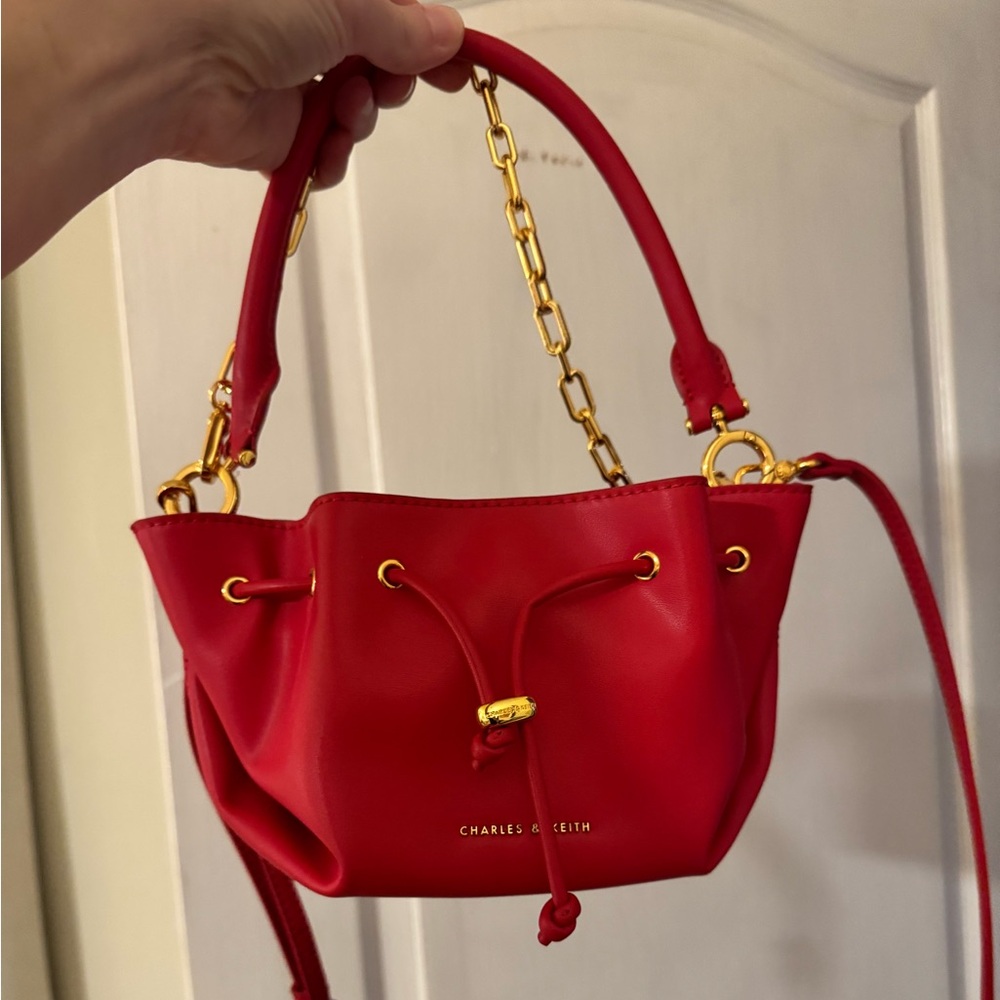 Gorgeous Charles & Keith Red Mini Bucket Bag with Gold Chain